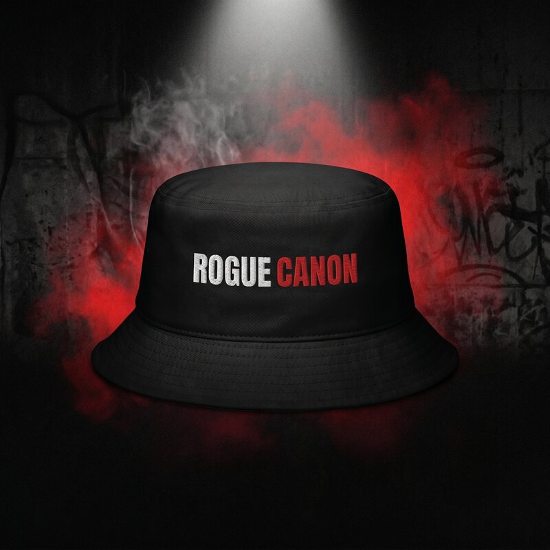 Black Rogue Canon old school bucket hat, worn by a model in a black polo