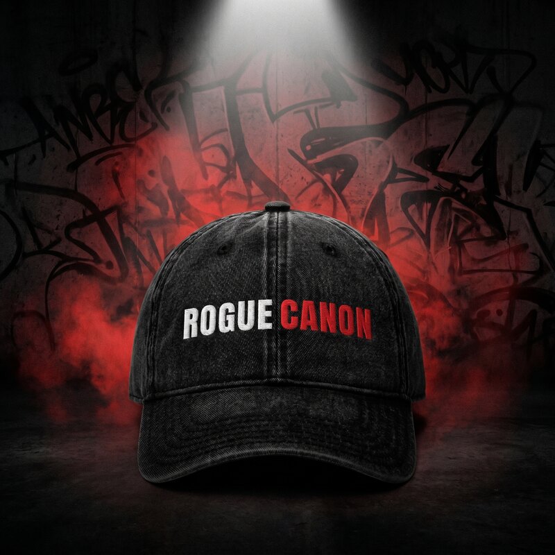 Black Rogue Canon embroidered vintage twill cap, worn by a model in a denim jacket